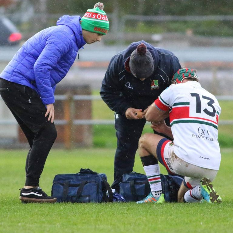 James providing pitch-side first aid to a Broadstreet RFC player during a match